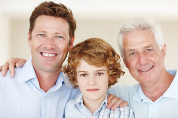 Boy, portrait and hug with dad or grandpa in home, support and happy for together generations in...
