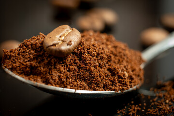 close up macro of coffee beans and powder 