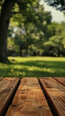 Fototapeta premium Wooden table close up with tree background