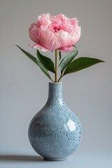 Blue vase with pink flower