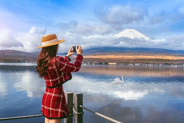 Tourist taking photo at Yamanakako lake, Japan.