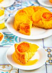 Orange cake with fruit citrus slices.