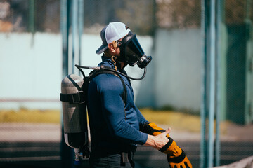 Firefighter training. Firefighters training on the sports ground.