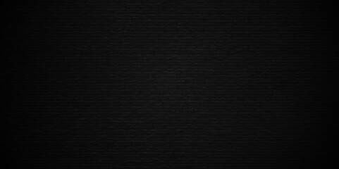 Abstract black stone wall texture grunge rock surface. dark gray background backdrop. wide panoramic banner. old wall stone for dark black distressed grunge background wallpaper rough concrete wall.