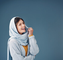 Thinking, fashion and happy muslim woman with dream in studio isolated on a blue background mockup...