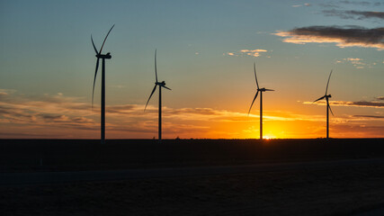 windmill, wind turbines at sunset