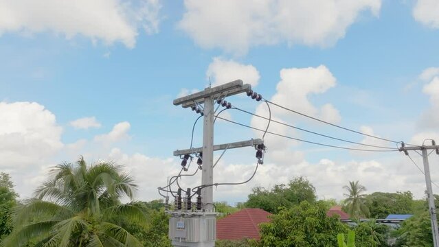 Power transformer mounted on pole in southeast asian.