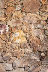 Very old stone wall, perfect for background.. Barcelona, Catalonia, Spain.