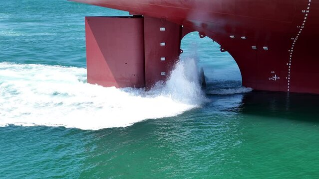 Propeller of large ship spinning power working and water splash contrail . Close up image detail Stern back of Vessel ship, Logistics Transportation industry express technology Freight 