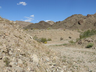 Fototapeta na wymiar View of Old Dirt Road - Arizona Desert - Arid Rocky Terrain