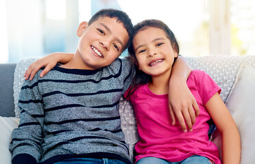 Children, hug and portrait of siblings in home, relax on sofa with care or support in happy family....