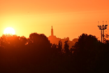Naklejka premium Sunrise with the Sacred Heart Monument in the background, Cerro de los Ángeles, Getafe, Madrid