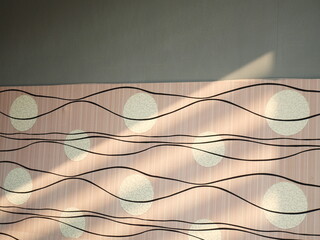 bedroom wallpaper is shined by the morning sunlight, creating beautiful shadows