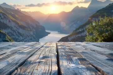 Wide-angle shot capturing sunrise over mountains with a clear view from aged wood grain textured boardwalk - obrazy, fototapety, plakaty