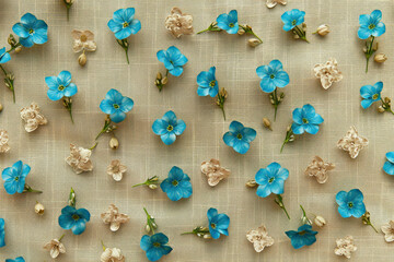 Blue Flowers on Beige Cloth Background, Floral Arrangement with Delicate Petals, Springtime Blooms on Neutral Fabric Texture