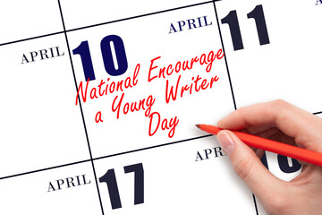 April 10. Hand writing text National Encourage a Young Writer Day on calendar date. Save the date.