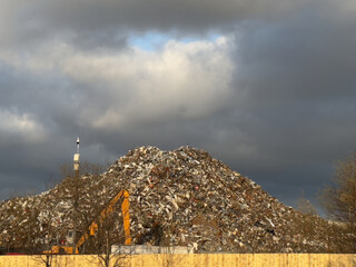Metal recycling compound showing large heap of rubbish