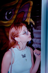 red hair girl with sun glasses on 