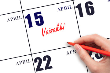 April 15. Hand writing text Vaisakhi on calendar date. Save the date.