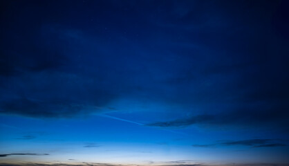 Fototapeta na wymiar Sunset in with dramatic storm clouds.