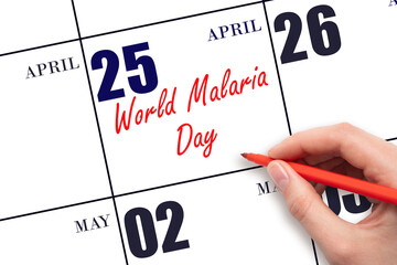 April 25. Hand writing text World Malaria Day on calendar date. Save the date.