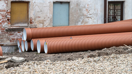 Pipes for drainage, stormwater, sewerage systems on the ground for installation.