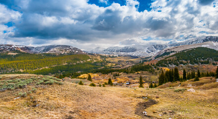 Showcasing the sprawling vistas of Colorado, this panoramic shot highlights the verdant forests and rugged mountains, a testament to the region's breathtaking nature