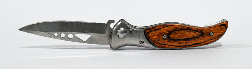 Beautifull wood and steel folding knife with white background.