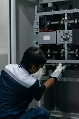 professional electrician checking power electrical system,preventive maintenance electricity in mdb...