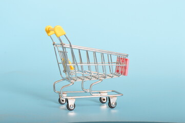 supermarket trolley stands as a symbol of consumer autonomy and choice, ready to be filled with products