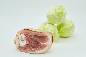 Raw meat and cabbage for cooking cabbage soup. Different parts of meat products for different dishes.
