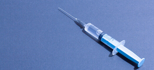 Disposable plastic syringe prepared for injection and vaccination in the hospital. The concept of...