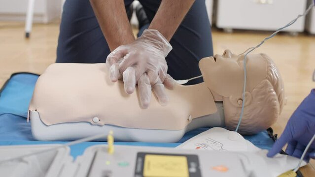 Medical procedure: practicing first aid on a mannequin