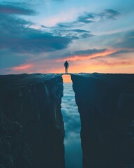 A figure standing at the edge of a gap, preparing to jump across to the other side, embodying the challenge and navigation of obstacles - obrazy, fototapety, plakaty