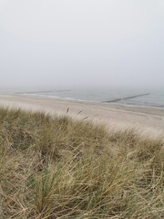 Fototapeta na wymiar foggy beach at the Baltic Sea in the north of Germany (Heiligendamm)