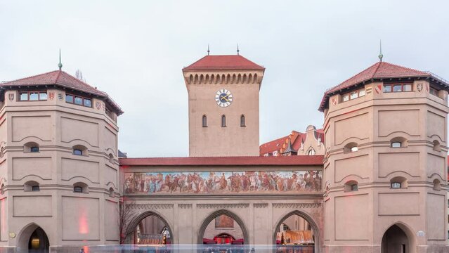The Isartor at the Isartorplatz in Munich timelapse. One of four main gates of the medieval city wall. The gate is located close to the Isar and was named after the river. Traffic on a street. Germany