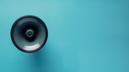 Top view of a loudspeaker on a blue background, styled as a mock-up for announcements or advertisements - obrazy, fototapety, plakaty