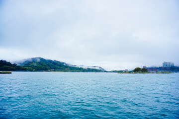 Sun Moon Lake，Nantou, Taiwan, Republic of China, 01 22 2024: The landscape of Sun Moon Lake in a cloudy and foggy day