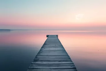Fotobehang Wooden Pier Leading into Calm Waters at Sunset, Pastel Sky, Copy Space © Martin Funk