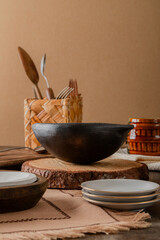 black traditional clay colombian soup bowl with a lot of different rustic kitchen and table items