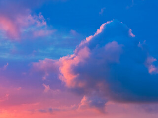 A stormy spring sunrise over the jurassic coastline with fiery purple and gold tinged clouds