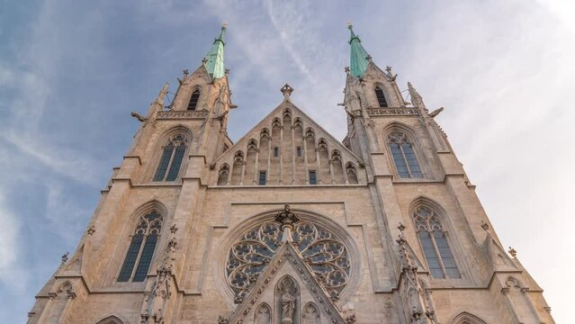 St. Paul's Church or Paulskirche timelapse. Looking up perspective. A large Catholic church in the Ludwigsvorstadt-Isarvorstadt quarter of Munich, Bavaria, Germany. Facade front view