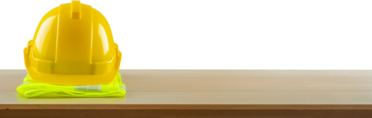 Yellow safety construction helmet on wood table isolated on white background