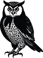 A close up of a black and white owl on a branch