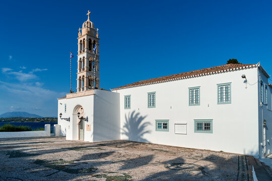 The church of Saint Nicholas (Agios Nikolaos), with its cobbled forecourt, the metropolitan church of Spetses island, in Greece, Europe, built in 1700.