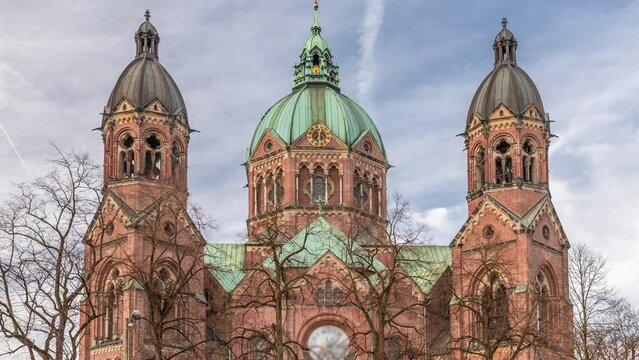 St. Luke's Church (St. Lukas or Lukaskirche) timelapse, the largest Protestant church in Munich, southern Germany. Cloudy sky and traffic on the street