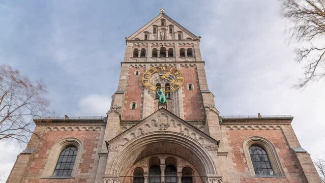St. Anna im Lehel is a parish of the Roman Catholic Church in the Lehel district of Munich timelapse. Looking up perspective. Front view. Clouds on the sky. Germany