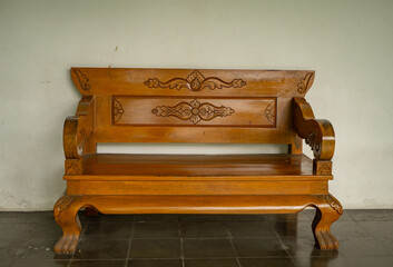 Old traditional wooden chair with java style. The photo is suitable to use for interior advertising content media.