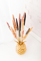 Dry grass bouquet on a white background