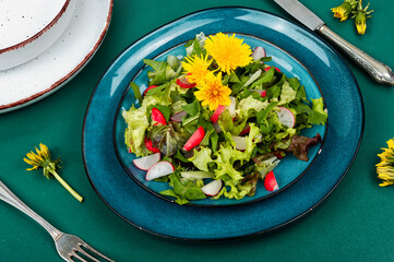 Fresh salad with dandelions, veganism.